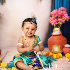 We celebrate culture and tradition with our unique themed shoots. This joyful portrait of a little one as Kanha, with his mischievous grin, is a perfect example of our custom Janmashtami photography sessions, complete with authentic costumes and vibrant props.