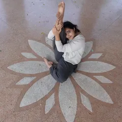 This is me, sitting in the middle of a lotus design, reflecting on my own growth. I'm not here to fit into an Instagram mold. I'm here to share what I've learned the hard way, so your path can be a little clearer.