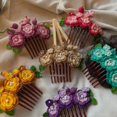 Our collection of floral crochet bun combs, available in a variety of beautiful colors. These are perfect for securing an updo with a touch of handmade elegance and are one of our bestsellers for wedding season.