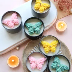 My new 'Mariposa' butterfly candles are here for the spring season. This photo shows the beautiful pink, yellow, and green floral butterfly designs, each in its own tin jar.