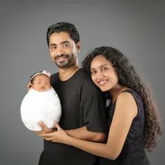 A beautiful first family portrait. The way they gaze at their new baby, and each other, is filled with so much love and wonder.