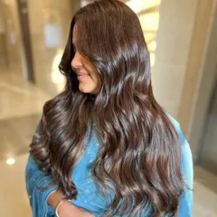 A beautiful example of a Gold Browns transformation, perfect for the festive season. This look involves creating rich, warm tones with seamless dimension and shine.