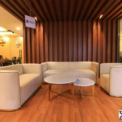 The waiting lounge of a corporate office, photographed to show a welcoming and professional space for visitors. These images help build a company's brand image.