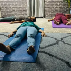 The final, most important pose of any session: Savasana. Here, students absorb the benefits of their practice, finding deep rest and relaxation.