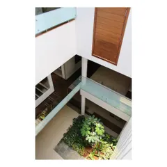 An overhead view of the internal court in the "Boxed In House" shows how we bring light and nature into the core of a home. This strategy creates a private, green sanctuary within a densely packed suburban environment.