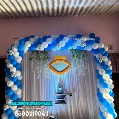 This naming ceremony decoration features a Shivling and Nandi, creating a divine theme for the baby's blessing. The blue and white balloon arch frames the sacred setup beautifully.