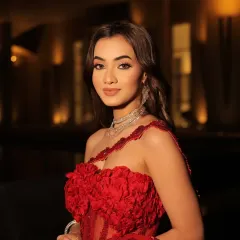 A gorgeous red to style for a glam day. This close-up highlights the 3D floral details on the blouse and the sparkling diamond jewelry.