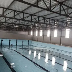 Another view of our indoor pool during its setup phase, showcasing the spacious, well-lit training environment.