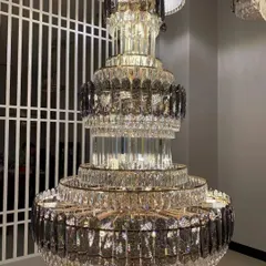 For spaces that demand pure opulence, I offer grand crystal chandeliers like this multi-tiered masterpiece. This is a modern take on the classic jhumar, designed to create a breathtaking cascade of light in a double-height foyer or a luxurious ballroom.