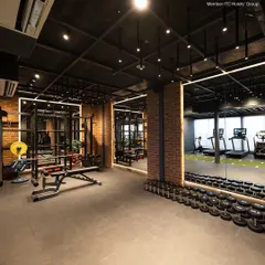 My 24-hour fitness center features a comprehensive free weights section with a full range of dumbbells and benches. The industrial chic design and spacious layout provide an motivating environment for your strength training workout.