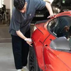 My partner and I tag-teaming the custom Ford Mustang project. It took a lot of time and a steady hand to get all those lines just right.