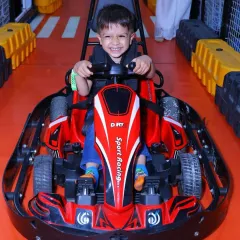 We love seeing the pure joy on our young racers' faces! Our kid-friendly electric go-karts offer a thrilling yet completely safe indoor racing experience on a dedicated track.