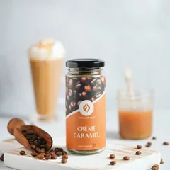 A clean, bright product shot focusing on the Crème Caramel coffee jar. This type of image is essential for e-commerce, showcasing the product with its ingredients in a fresh and appealing setting.