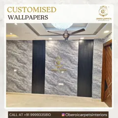 Here, I've used a grey marble-effect custom wallpaper as the main feature, with two vertical sections of black fluted panels to add structure and contrast. This combination creates a bold and modern statement wall.