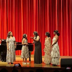 A different angle of our classical ensemble performance, highlighting our stage presence and interaction.