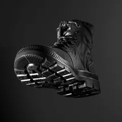 A dramatic, low-angle shot of a Jack & Jones boot against a black background. This "hero" angle makes the product look powerful and emphasizes the rugged sole.