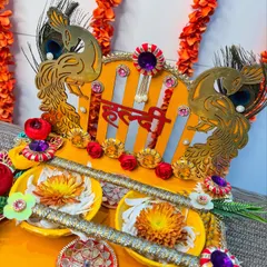 A close-up of the majestic peacock cutouts and floral details on our yellow Haldi platter. We love adding these traditional yet artistic elements to make your ceremony even more special.