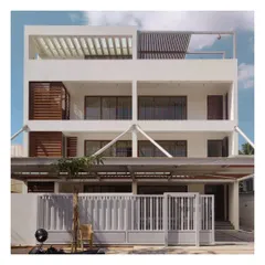 This contemporary residence was originally designed as an office but was adapted to become a home. The facade is defined by its clean geometry, white walls, and wooden louvered screens for privacy and sun shading.