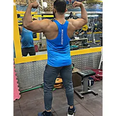 Hitting a back double biceps pose to check progress. A strong back not only looks impressive but is also essential for stability in all major lifts.