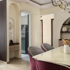 This view shows how the mandir's design harmonizes seamlessly with the dining area, blending traditional spirituality with contemporary elegance to create a peaceful and integrated sacred space.