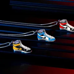 For these sneaker-themed pendants from Orionz Jewels, we used colored gels to create red and blue light streaks. This technique adds motion and energy to the shot, perfectly matching the product's streetwear vibe.