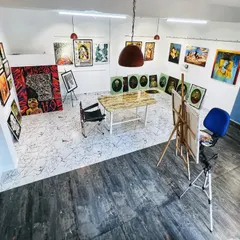 A wide-angle view of my studio, showing the gallery walls filled with various completed artworks. This space is both my workshop and my showroom, where every piece is on display before it finds a new home.
