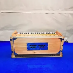 This image shows the compact profile of our standard 9-stopper harmonium. We ensure every instrument has a smooth bellows action and responsive keys before it reaches you.