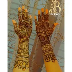 This design has a beautiful mix of everything traditional. It features a central mandala, peacock motifs, and detailed pattern work for a very rich and full look.