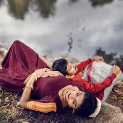 An artistic and romantic pose from the same shoot. The bride-to-be's traditional makeup and hairstyle look stunning against the natural backdrop.
