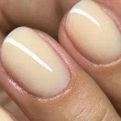 The perfect Russian Manicure. Notice the incredibly clean cuticle line and the smooth, flawless application of this jelly nude gel polish. This meticulous technique ensures your manicure not only looks perfect but also lasts longer.