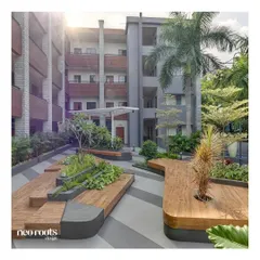 This shot of the Atria University campus shows the dynamic, multi-level seating areas we created using curved wooden decks and concrete planters. The design encourages student interaction and provides ample space for both individual study and group gatherings.