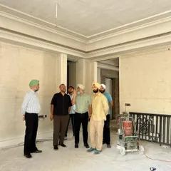 Our principals believe in being present on the ground. Here, our team is on-site at a residential project, having a discussion with the client. Walking through the space provides a clarity that drawings cannot, turning conversations into real-time decisions.