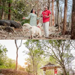 We love incorporating playful and spontaneous moments into our shoots. Here, the couple shares a joyful moment with their dog amidst falling leaves in a wooded area, creating a dynamic and heartwarming family photograph.