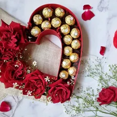 A classic gesture of love. This heart-shaped box combines lush red roses with decadent Ferrero Rocher chocolates, making it a perfect gift for Valentine's Day, anniversaries, or just to show someone you care.