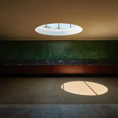 I see every space as an opportunity for art. Here, in a wedding venue, a simple circular skylight transforms a functional area into a canvas for the sun, creating a moving piece of art as light travels across the room throughout the day.