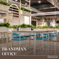 Welcome to the Brandman Office, a space I designed to inspire and energize. By infusing the office with modern elegance, functional workstations, and lush greenery, I created a truly productive environment.