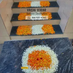 The celebration starts right at the doorstep. For this welcome home decoration, I created a lovely flower rangoli at the entrance and decorated the stairs with patterns of white and orange flower petals.