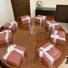 A fleet of personalized bridesmaid proposal boxes ready to go. Each box is customized with the recipient's name in elegant script, making the gift feel personal from the moment they see it.