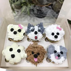 How cute are these puppy-faced cupcakes? I had so much fun piping the different fur textures and expressions for a dog lover's birthday. I can create custom designs like these to match any theme or passion.