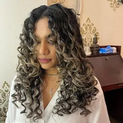 For Tanya's curl transformation, a K18 bond-building treatment was essential after her haircut to ensure her highlighted curls were healthy and defined.