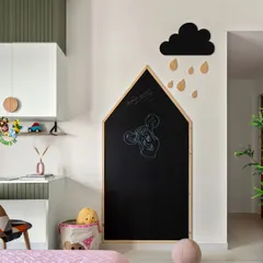 This kids' room features a whimsical house-shaped chalkboard, perfect for unleashing creativity. The study area combines olive green and white cabinets with circular wooden knobs for a playful yet stylish look.