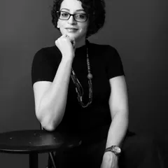 A simple, direct black and white portrait can be incredibly impactful. This headshot captures a moment of quiet confidence and focus, ideal for a professional who wants to convey expertise and trustworthiness.