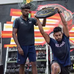 I work closely with elite athletes like Roy Krishna, Fiji's captain and an ISL legend, to ensure they return to sport stronger than before. Here, I am guiding him through a targeted strength exercise, focusing on precise form to build power and prevent re-injury. This level of personalized coaching is central to my approach for every athlete.