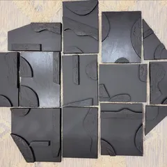 This is a multi-panel sculptural piece made from acrylic on board. Each of the 13 panels is uniquely shaped and textured, designed to be arranged into a larger, cohesive abstract composition.