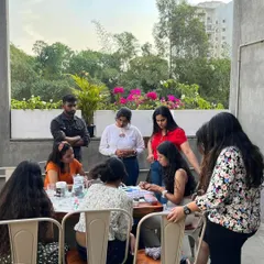 A candid shot from a rooftop painting session. I love guiding everyone through their process, whether they need help with a brushstroke or mixing the perfect color. It's a collaborative and supportive atmosphere.