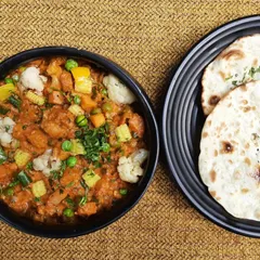 A classic pairing you can never go wrong with. Our Subz Dum Matka, a medley of fresh vegetables in a thick gravy, is served with soft, fluffy Kulchas, making it a wholesome and satisfying meal.