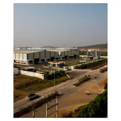 An expansive view of the Krishna Sai Granites campus, demonstrating our capability in industrial master planning. The layout strategically positions four main blocks, including three granite processing units and an admin building, for optimal operational efficiency across the 9.5-acre site.