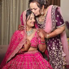 A mother's kiss and blessing. The bride's soft glam makeup is perfect for this emotional and beautiful moment.