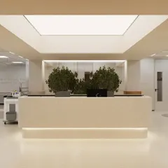 The main reception desk of the ICU is designed to be welcoming yet professional. A large skylight and integrated planters introduce natural elements right at the entrance, setting a serene tone for families and visitors from the moment they arrive.