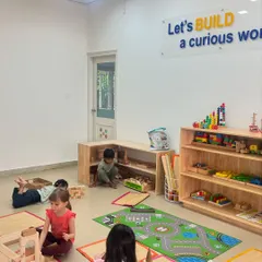 I build, I learn. Our block zone is a hub of creativity and engineering. We provide the space and materials, and the children lead the way, building everything their imaginations can conceive, from tall towers to intricate cities.